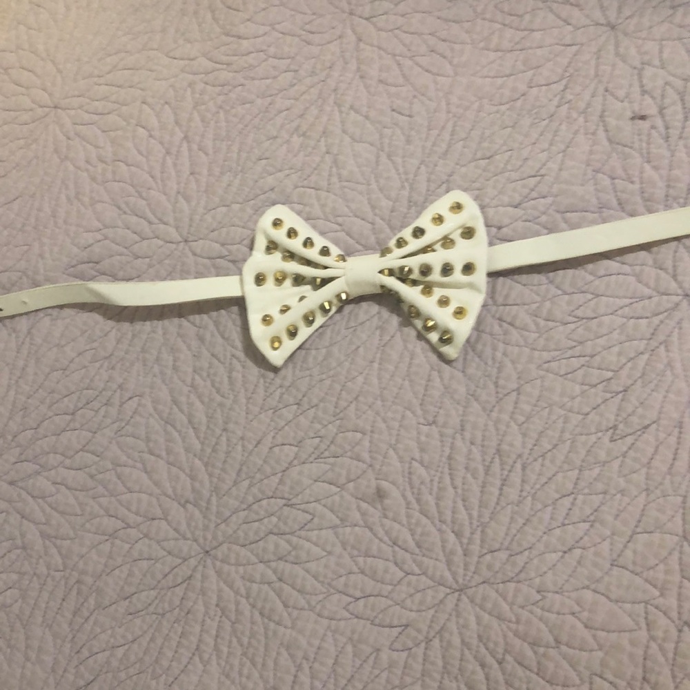 Dress belt white with gold studs.